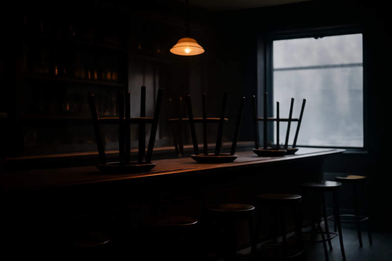 Empty New Jersey bar interior with chairs stacked after an alcohol license shutdown